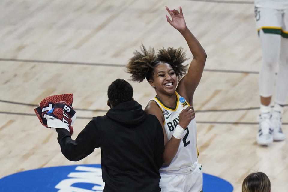 Baylor guard DiDi Richards (2) celebrates the team's overtime win over Michigan in a college basketball game in the Sweet Sixteen round of the women's NCAA tournament at the Alamodome in San Antonio, Saturday, March 27, 2021. (AP Photo/Eric Gay)