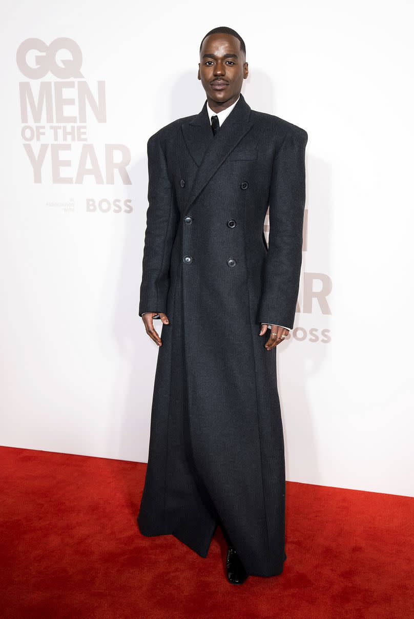 Ncuti Gatwa poses for photographers upon arrival at the GQ Men of the Year Awards in London, Wednesday, Nov. 15, 2023.