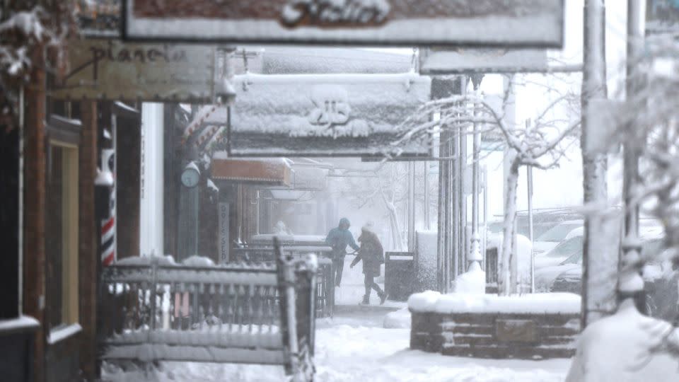 A person shovels snow in Truckee, California. - Mario Tama/Getty Images