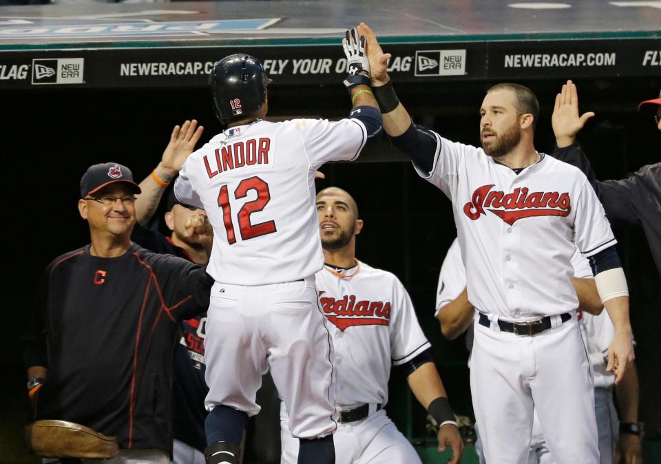 Francisco Lindor, center, is congratulated by Cleveland manager Terry Francona, left, and Jason Kipnis, right, after Lindor hit a solo home run during the sixth inning against Houston, July 9, 2015, in Cleveland.