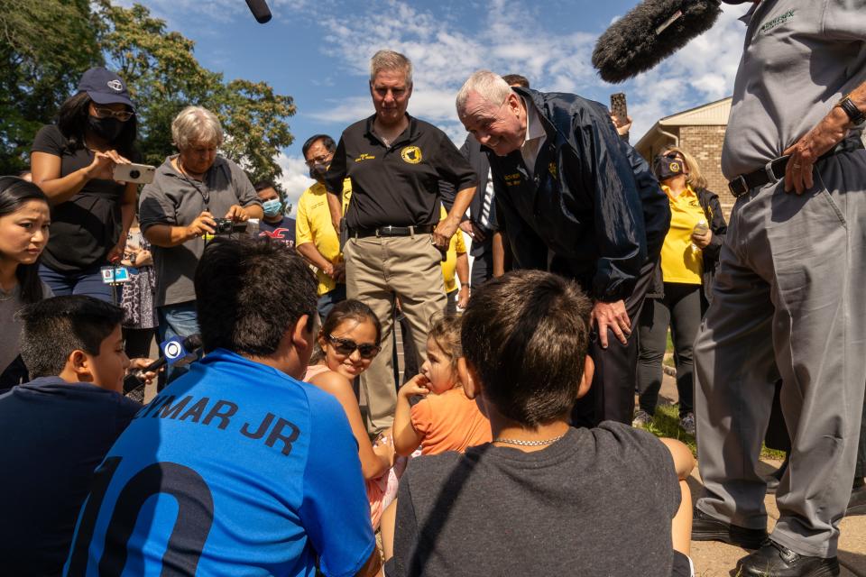 Gov. Phil Murphy talks to residents at the Birchview Garden Apartments on River Road in Piscataway after flooding from Hurricane Ida.