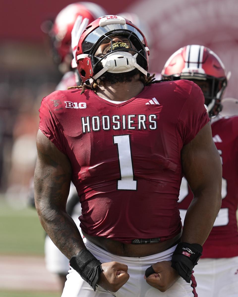 Indiana defensive lineman Andre Carter reacts after a tackle during the first half of an NCAA college football game against Ohio State, Saturday, Sept. 2, 2023, in Bloomington, Ind. (AP Photo/Darron Cummings)