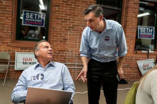 PHOTO: Rhode Island General Treasurer and Democratic candidate for the state's 2nd Congressional District, Seth Magaziner, right, talks with Rep. David Cicilline, as they make calls to voters from a campaign office in Providence, R.I., Nov. 7, 2022. (David Goldman/AP)