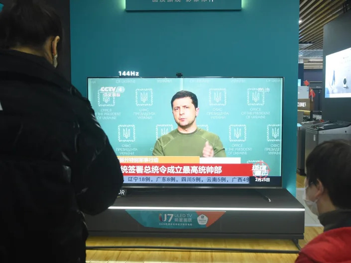 A Chinese citizen watches a news report on the conflict between Russia and Ukraine at an appliance store in Hangzhou, east China's Zhejiang Province, Feb 25, 2022. (Photo credit should read Costfoto/Future Publishing via Getty Images)