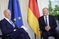German Chancellor Olaf Scholz, right, welcomes US President Joe Biden, left, for a bilateral meeting at Castle Elmau in Kruen, near Garmisch-Partenkirchen, Germany, on Sunday, June 26, 2022. The Group of Seven leading economic powers are meeting in Germany for their annual gathering Sunday through Tuesday. (Leonhard Foeger/Pool Photo via AP)