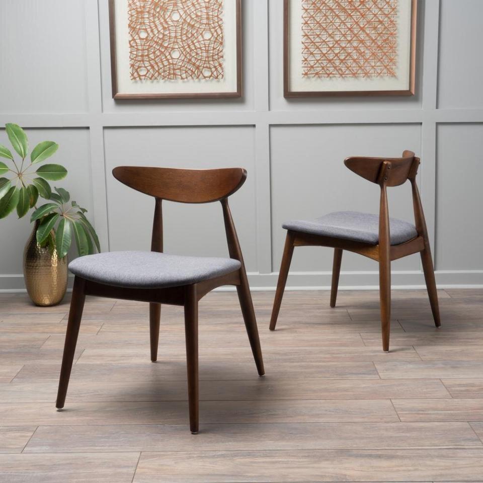 All you midcentury modernists can snag these dining chairs on sale. With a walnut finish on the legs and a charcoal cushion, these will stay classic. <a href="https://fave.co/314dGAg" target="_blank" rel="noopener noreferrer">Originally $172, get the set now for $129 at The Home Depot</a>.