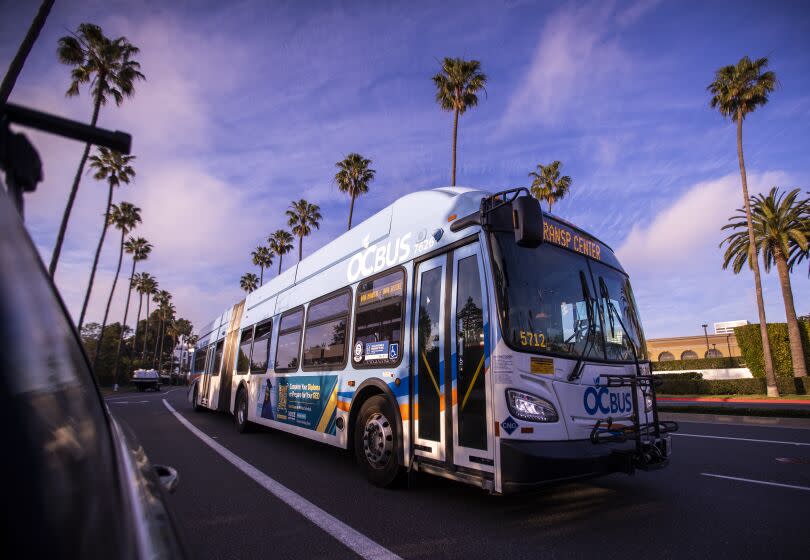 Newport Beach, CA - February 14: A bus driver drives an Orange County Transportation Authority bus. along its route in Newport Beach Monday, Feb. 14, 2022. Nearly 600 Orange County Transportation Authority (OCTA) bus drivers in Southern California are set to strike Tuesday, February 15, if negotiations with Teamsters Local 952 fail to produce an agreement before then. The previous contract expired almost a year ago, on April 30, 2021. (Allen J. Schaben / Los Angeles Times)