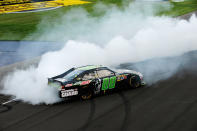 BROOKLYN, MI - JUNE 17: Dale Earnhardt Jr., driver of the #88 Diet Mountain Dew/TheDarkKnightRises/National Guard/ Chevrolet, celebrates winning the NASCAR Sprint Cup Series Quicken Loans 400 with a burnout at Michigan International Speedway on June 17, 2012 in Brooklyn, Michigan. (Photo by Jared C. Tilton/Getty Images)