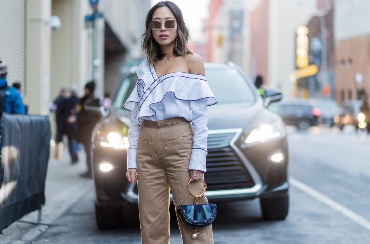 Aimee Song wearing an off-the-shoulder blouse at New York Fashion Week this month. (Photo: Getty)