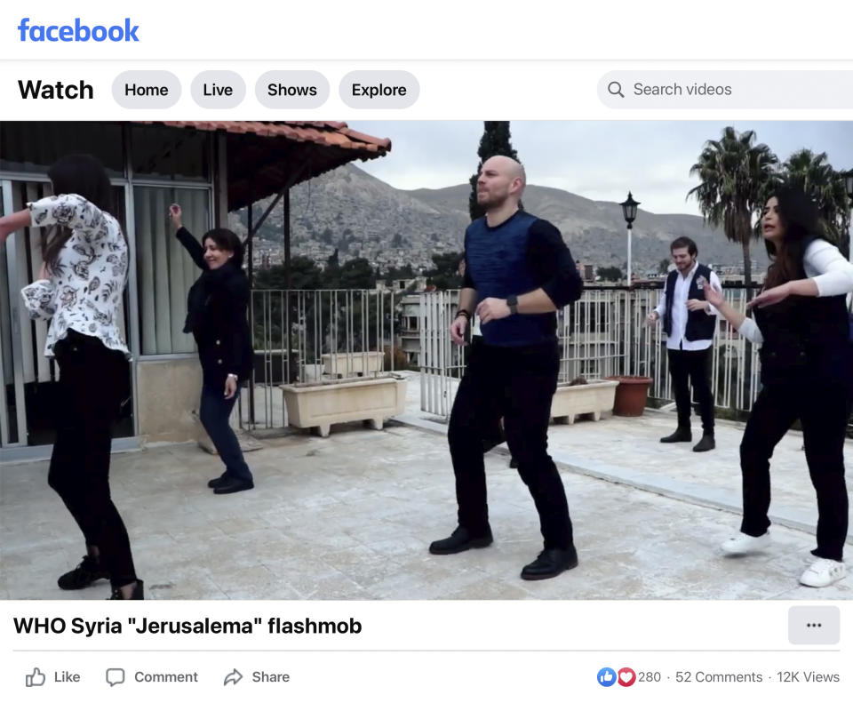In this image from a video posted by the World Health Organization, Syria Facebook account on Dec. 15, 2020, Dr. Akjemal Magtymova, second from left, participates in a dance routine with WHO personnel. In December 2020, deep in the first year of the pandemic, Magtymova instructed the Syria office to learn a flash mob dance popularized by a social media challenge for a year-end U.N. event. At the time, senior WHO officials in Geneva were advising countries to implement coronavirus measures including the suspension of any non-essential gatherings. (AP Photo)