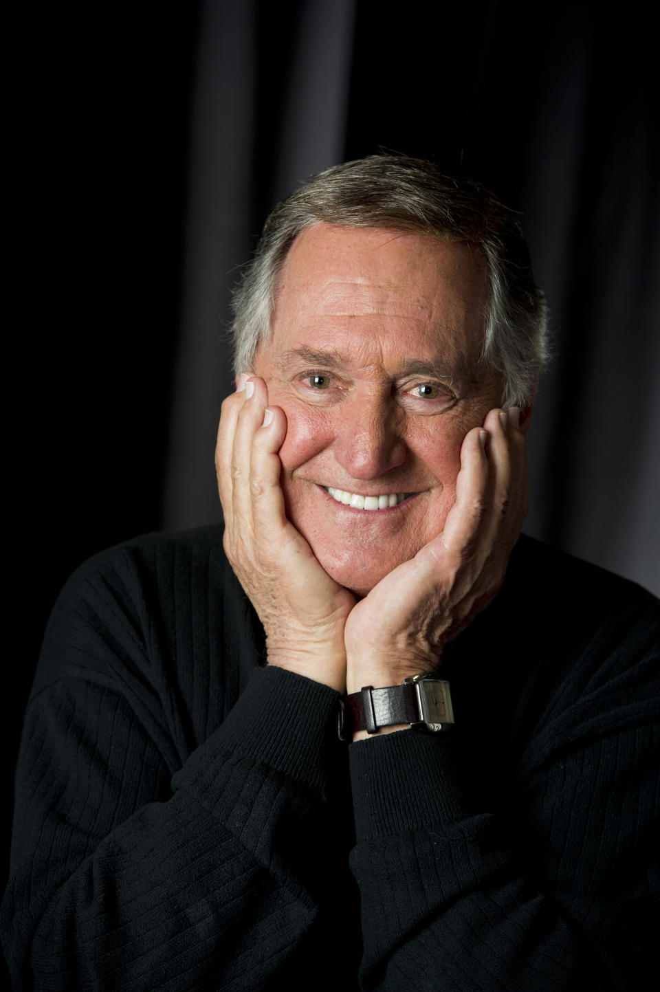 In this April 30, 2012 file photo, singer and children's book author Neil Sedaka poses for a portrait in New York. At 73, the singer-songwriter enlisted the aid of his twin granddaughters as kiddie backup singers on the three-song CD tucked into the children's book "Dinosaur Pet," a book inspired by his 1960 "Calendar Girl." (AP Photo/Charles Sykes)