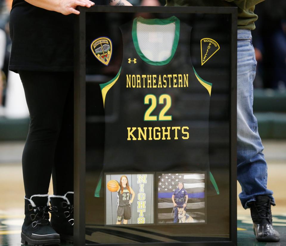 Northeastern encased Seara Burton's No. 22 jersey to display right outside the gym so everyone can remember her.