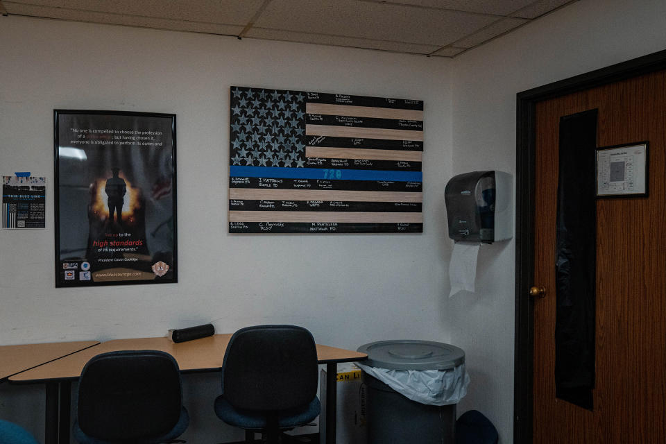 A thin blue line flag poster on display in an out-of-use classroom.<span class="copyright">Jovelle Tamayo for TIME</span>