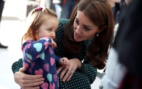 The Duchess meets a shy little girls at Evelina Children's Hospital - Credit: Getty