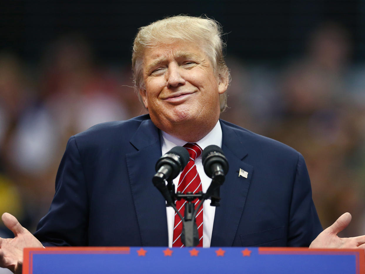 Donald Trump displays the 'zipped smile': Getty