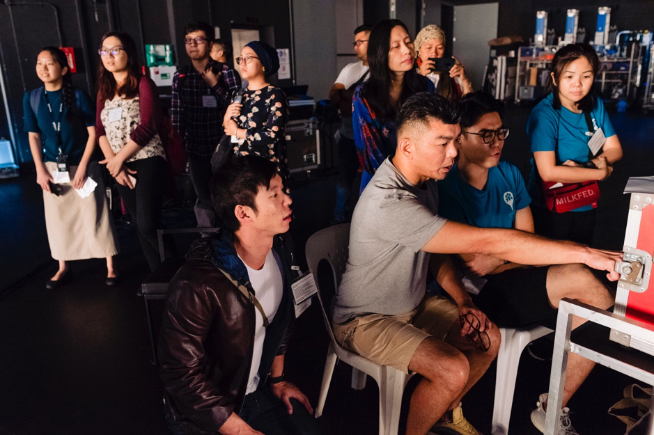 Foreground, L-R: creative producer Benjamin Tan, filmmaker Royston Tan and filmmaker Alvin Lee. The music video shoot of Majulah Singapura on 22 October 2019, a project conceived by events creative director Benjamin Tan, performed by Ramli Sarip and featuring Singaporeans representing different notions of progress. (PHOTO: SidexSide Photography)