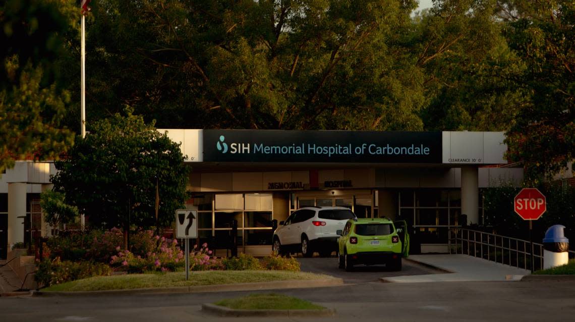 Cars line up at the entrance of Southern Illinois Healthcare’s Carbondale Memorial Hospital on July 19.