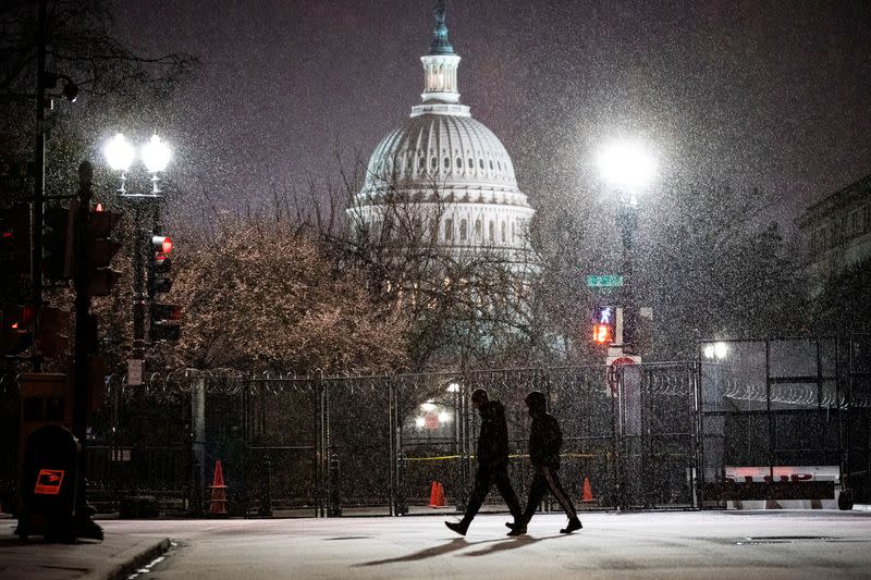 People walk through the snow on Capitol Hill