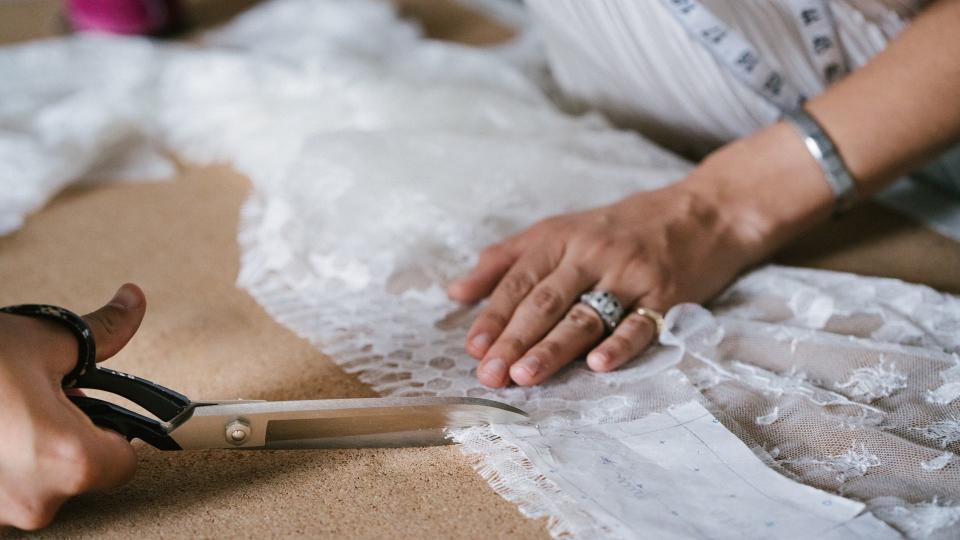 Haute couture designer making wedding gown