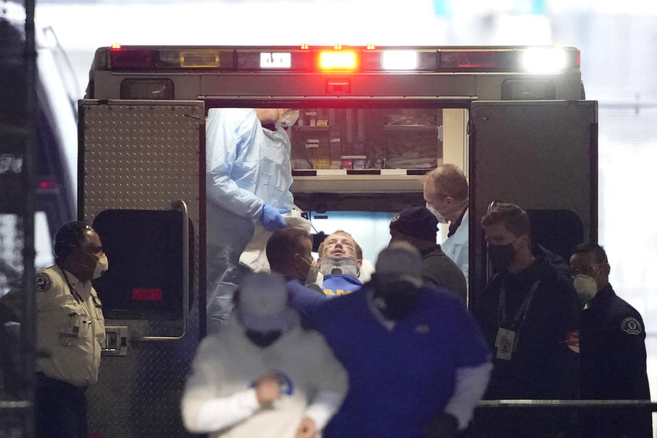 Los Angeles Rams quarterback John Wolford leans back after walking into an ambulance parked in a tunnel just off the field during the first half of an NFL wild-card playoff football game against the Seattle Seahawks, Saturday, Jan. 9, 2021, in Seattle. (AP Photo/Ted S. Warren)