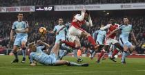 Football Soccer Britain - Arsenal v Burnley - Premier League - Emirates Stadium - 22/1/17 Arsenal's Laurent Koscielny is fouled by Burnley's Ben Mee in the area resulting in a penalty to Arsenal Reuters / Dylan Martinez Livepic