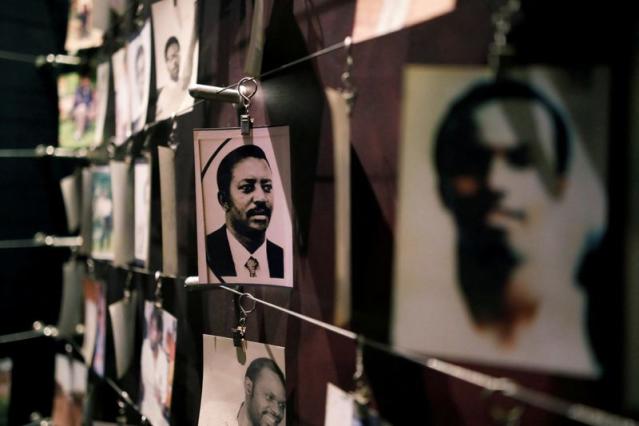 FILE PHOTO: Pictures of the Rwandan Genocide victims donated by survivors are displayed at an exhibition at the Genocide Memorial in Gisozi in Kigali