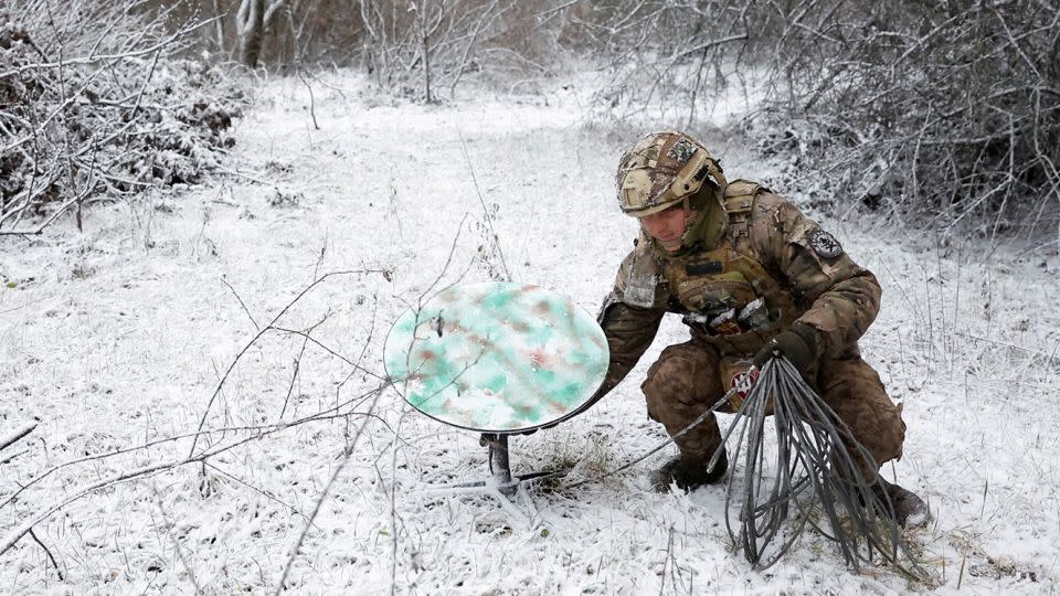 A Ukrainian soldier disconnects their Starlink on the front line   during a ceasefire announced by Russia over the Orthodox Christmas period,  January 6, 2023.  - Clodagh Kilcoyne/Reuters