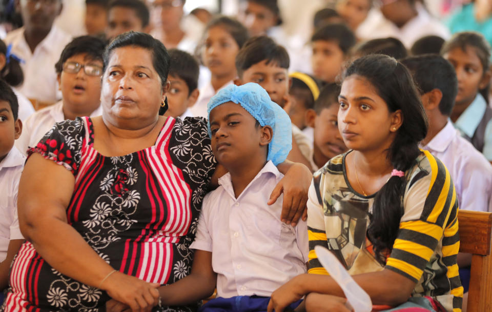 Survivors of the Easter Sunday attacks listen to Archbishop of Canterbury Justin Welby at St. Sebastian's church in Katuwapitiya village, Negombo , Sri Lanka, Thursday, Aug. 29, 2019. The figurehead of the Church of England emphasized the need for Christian unity on Thursday as he paid tribute to the victims of the Easter Sunday bomb attacks at a Roman Catholic church in Sri Lanka. A total of 263 people were killed when seven suicide bombers from a local Muslim group attacked three churches and three luxury hotels on April 21. (AP Photo/Eranga Jayawardena)