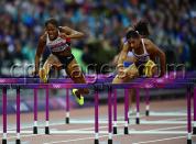 Canada's Phylicia George (left) competes in the women's 100-metre hurdle semifinals at the Olympic Stadium during the Summer Olympics in London on Tuesday, August 7, 2012. THE CANADIAN PRESS/Sean Kilpatrick