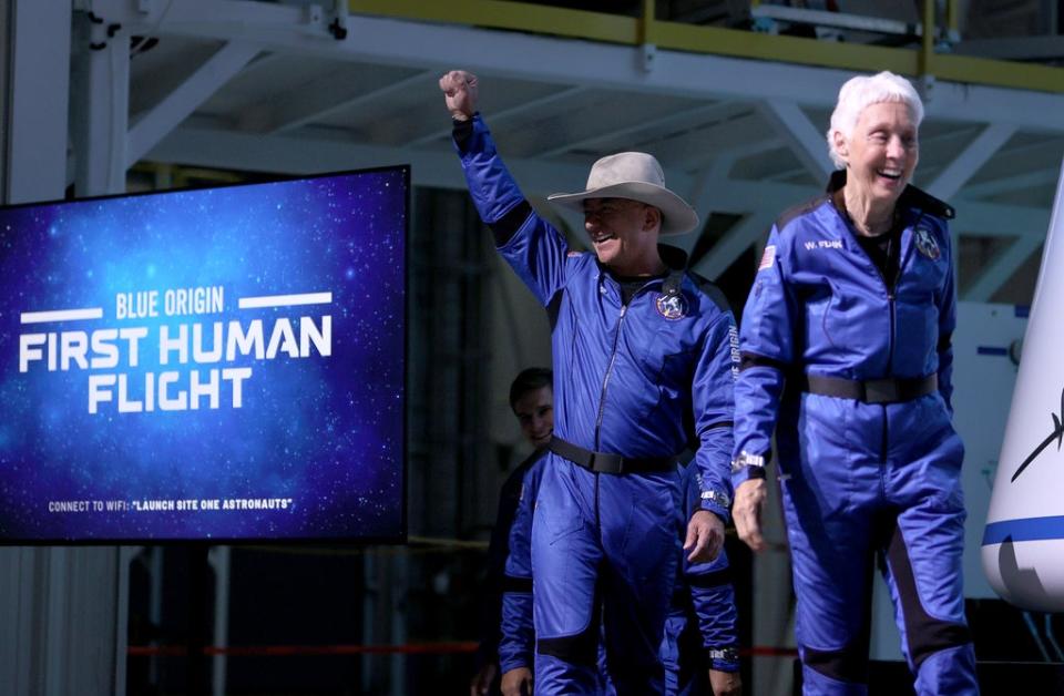 Blue Origin’s New Shepard crew (L-R) Jeff Bezos and Wally Funk arrive for a press conference after flying into space in the Blue Origin New Shepard rocket (Getty Images)