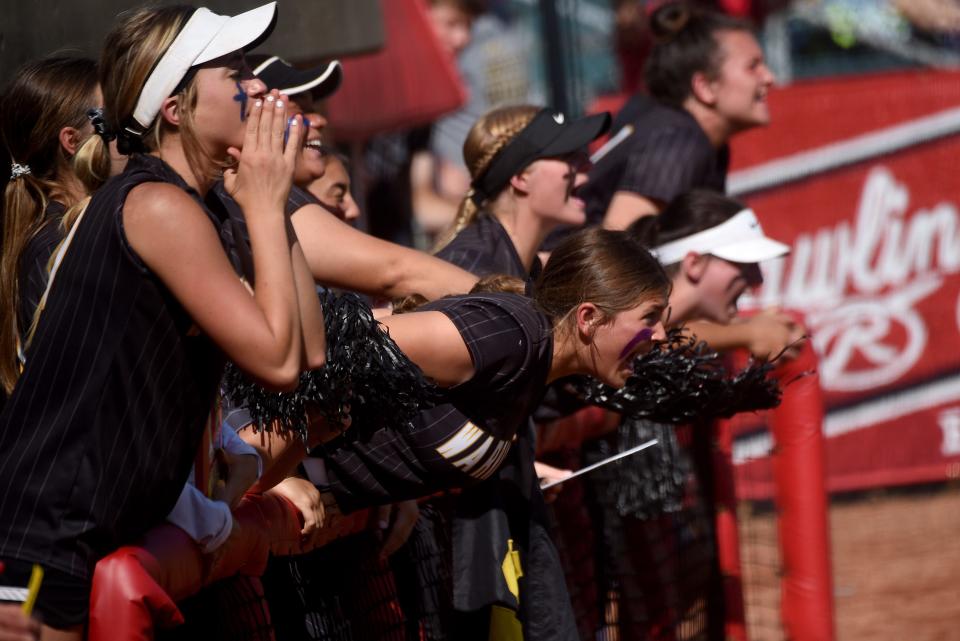 Watkins Memorial players cheer from the dugout at Firestone Stadium on Thursday, during the 4-2 Division I state semifinal loss to Holland Springfield.