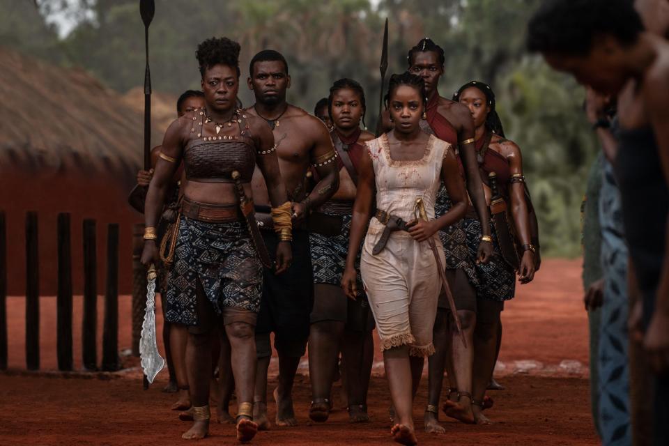Viola Davis (left) stars as a fearsome general of an all-female warrior unit protecting their African nation in "The Woman King."