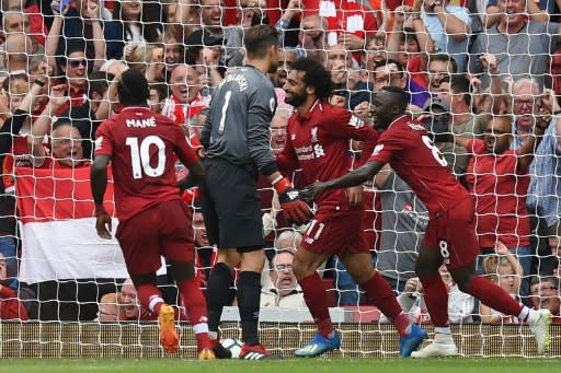 Up and running: Mohamed Salah celebrates his first goal of the season