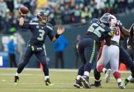 Nov 23, 2014; Seattle, WA, USA; Seattle Seahawks quarterback Russell Wilson (3) passes the ball against the Arizona Cardinals during the second half at CenturyLink Field. Seattle defeated Arizona 19-3. Mandatory Credit: Steven Bisig-USA TODAY Sports