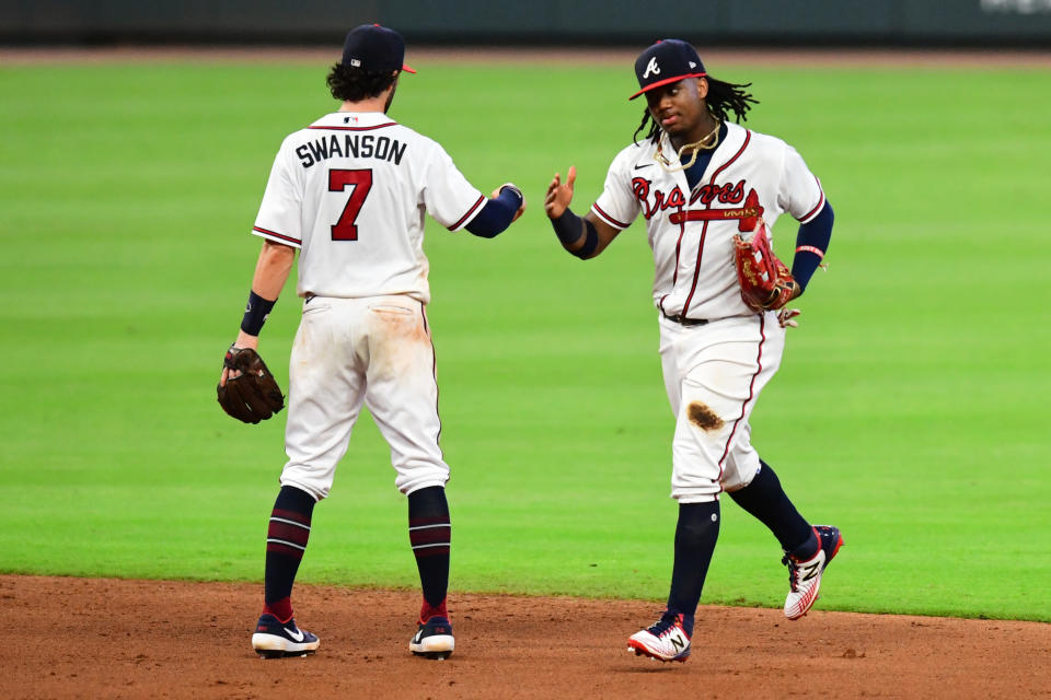 Ronald Acuna Jr. #13 celebrates with Dansby Swanson #7 of the Atlanta Braves after beating the New York Mets at Truist Park on August 01, 2020 in Atlanta, Georgia. (Photo by Scott Cunningham/Getty Images)