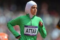 Saudi Arabia's Sarah Attar competes in the women's 800m heats at the athletics event of the London 2012 Olympic Games on August 8, 2012 in London. AFP PHOTO / JOHANNES EISELE