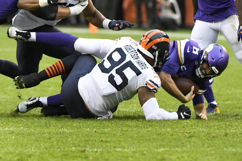 Minnesota Vikings quarterback Kirk Cousins (8) is sacked by Chicago Bears defensive end Roy Robertson-Harris (95) during the second half of an NFL football game Sunday, Sept. 29, 2019, in Chicago. (AP Photo/Matt Marton)