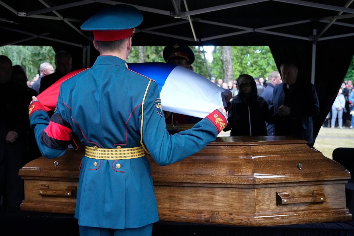 Honor guards remove a Russian flag from the coffin of former Soviet President Mikhail Gorbachev during his funeral at Novodevichy Cemetery in Moscow, Russia, Saturday, Sept. 3, 2022. 