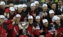 Team Canada poses for photographers after winning the Ice Hockey World Championship final game at the O2 arena in Prague, Czech Republic May 17, 2015. REUTERS/David W Cerny TPX IMAGES OF THE DAY