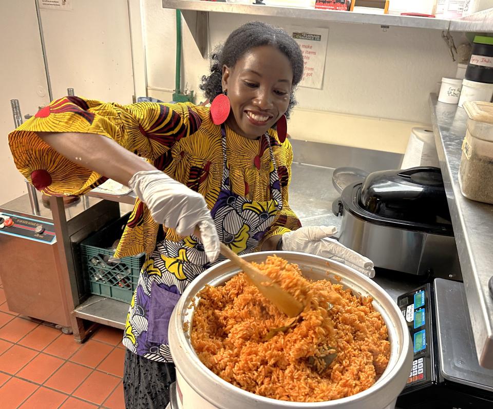 Charity Abban-Saah preparing Jollof rice for customers on Feb. 17, 2024, at her Redding restaurant. Amazing Alheri serves West African food.
