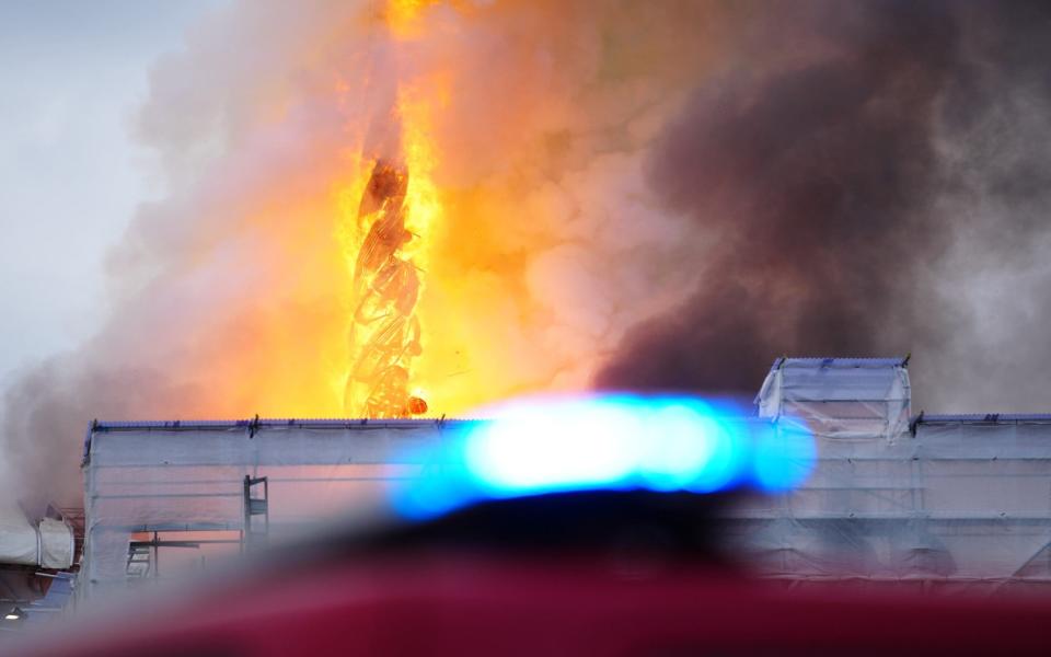 Flames and smoke rise from the old Stock Exchange in Copenhagen