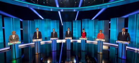 (L-R) Natalie Louise Bennett the leader of the Green Party, Nick Clegg the leader of the Liberal Democrats, Nigel Farage the leader UKIP, Ed Miliband the leader of the Labour Party, Leanne Wood the leader of Plaid Cymru, Nicola Sturgeon the leader of the Scottish National Party (SNP) and David Cameron the leader of the Conservative Party and Britain's current Prime Minister stand during the leaders televised election debate at Media City in Salford in Northern England, in this April 2, 2015 handout picture provided by ITV. REUTERS/Peter Gray/ITV/Handout via Reuters