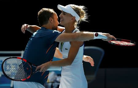 Russia's Elena Vesnina and Brazil's Bruno Soares celebrate after winning their mixed doubles final at the Australian Open tennis tournament at Melbourne Park, Australia, January 31, 2016. REUTERS/Issei Kato