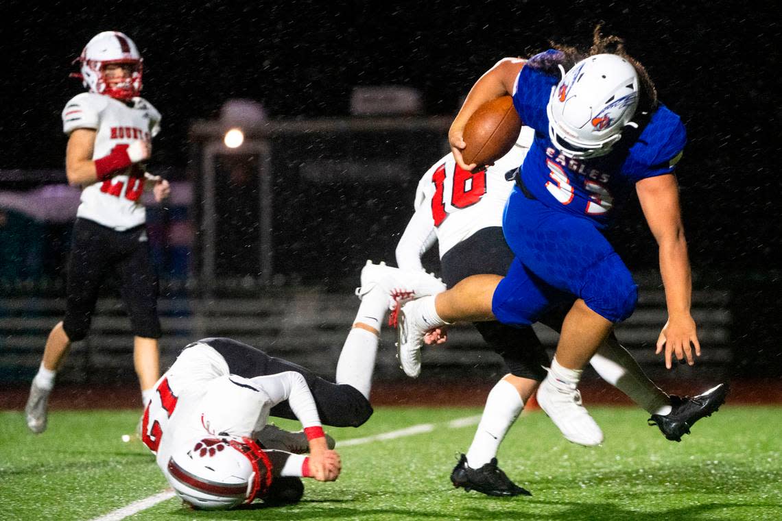 Graham-Kapowsin running back Michael Toa barrels through Mount Si’s Colby Heyting on his way into the endzone for a rushing touchdown in the fourth quarter of a Week 10 playoff game on Friday, Nov. 4, 2022, at Art Crate Field in Spanaway, Wash.