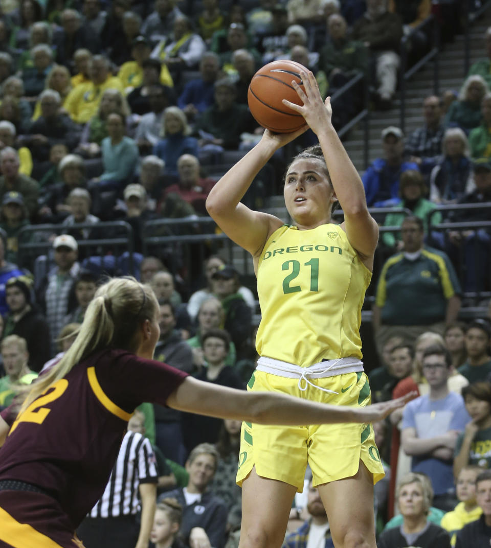 Oregon's Erin Boley, right, shots over Arizona State's Courtney Ekmark during the second quarter of an NCAA college basketball game Friday, Jan 18, 2019, in Eugene, Ore. (AP Photo/Chris Pietsch)
