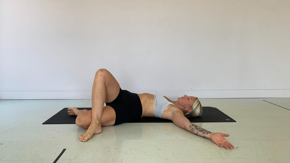 Woman doing Figure 4 stretch