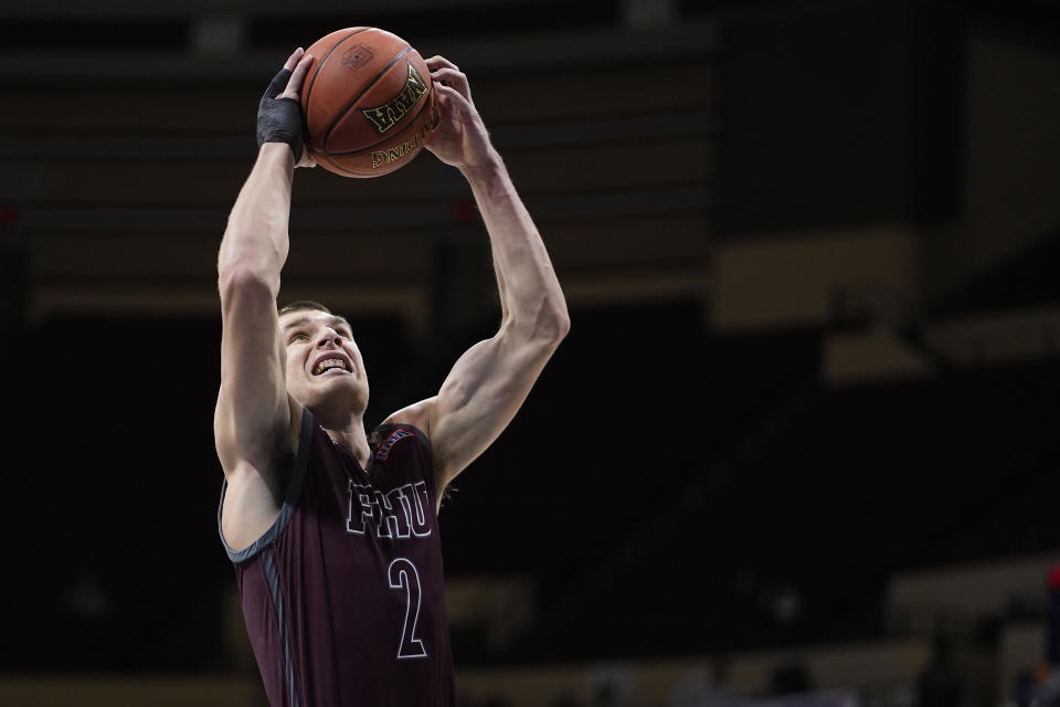 Freed-Hardeman forward Peyton Law (2) shoots during the first half of the NAIA men's national championship college basketball game against Langston, Tuesday, March 26, 2024, in Kansas City, Mo. (AP Photo/Charlie Riedel)