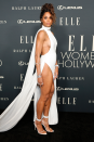 <p>Ciara attended the 2021 Elle Women in Hollywood event wearing this absolutely stunning white halterneck dress, designed by Mônot. </p><p>The gown features delicate draping around the neck, which flows into a train, but the most notable elements have to be the hip-high split on the skirt and cut-out sideboob detailing, giving the number a fierce finish. </p><p>Ciara finished the look with stacked silver bangles and rings, matching strappy heels and a delicate updo.</p>