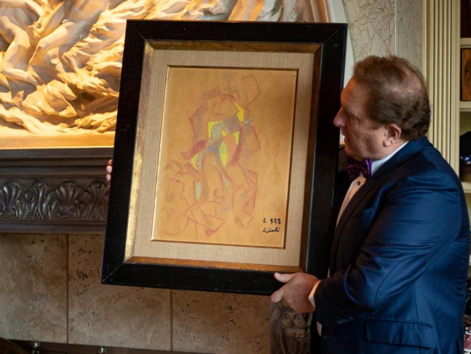 Dr. Christopher Heath Brown shows a rare piece called “Lady with a jug,” by Salvador Dalí when the artist was inspired by Picasso early in his career. Dalí only made a limited number of works in the cubism style before he moved on to surrealism later in his career.