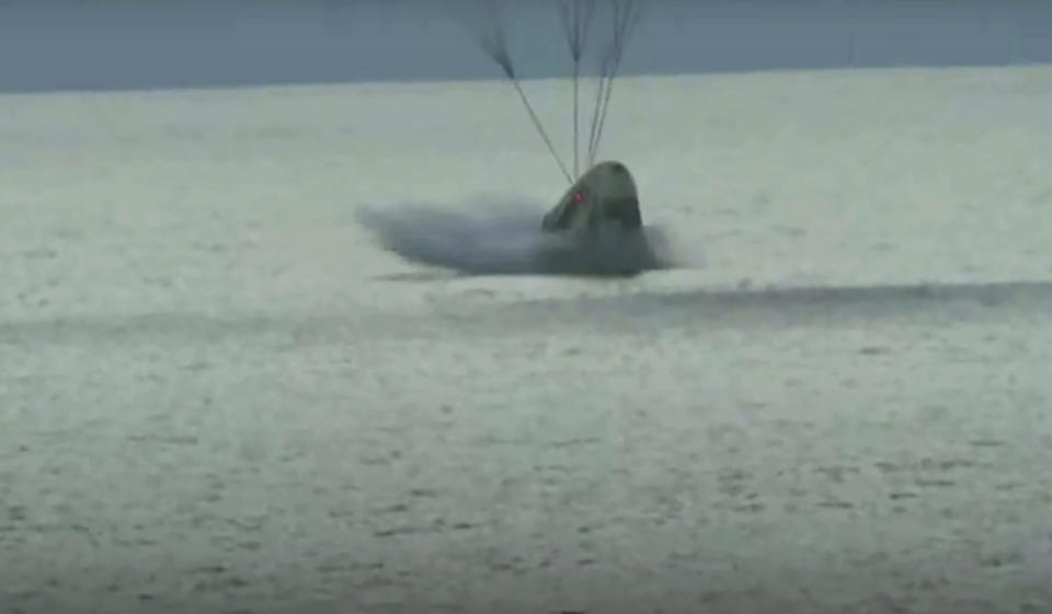 In this image taken from video a SpaceX capsule carrying four people splashes down in the Atlantic off the Florida coast, Saturday, Sept. 18, 2021. The all-amateur crew was the first to circle the world without a professional astronaut. (Inspiration4 via AP)